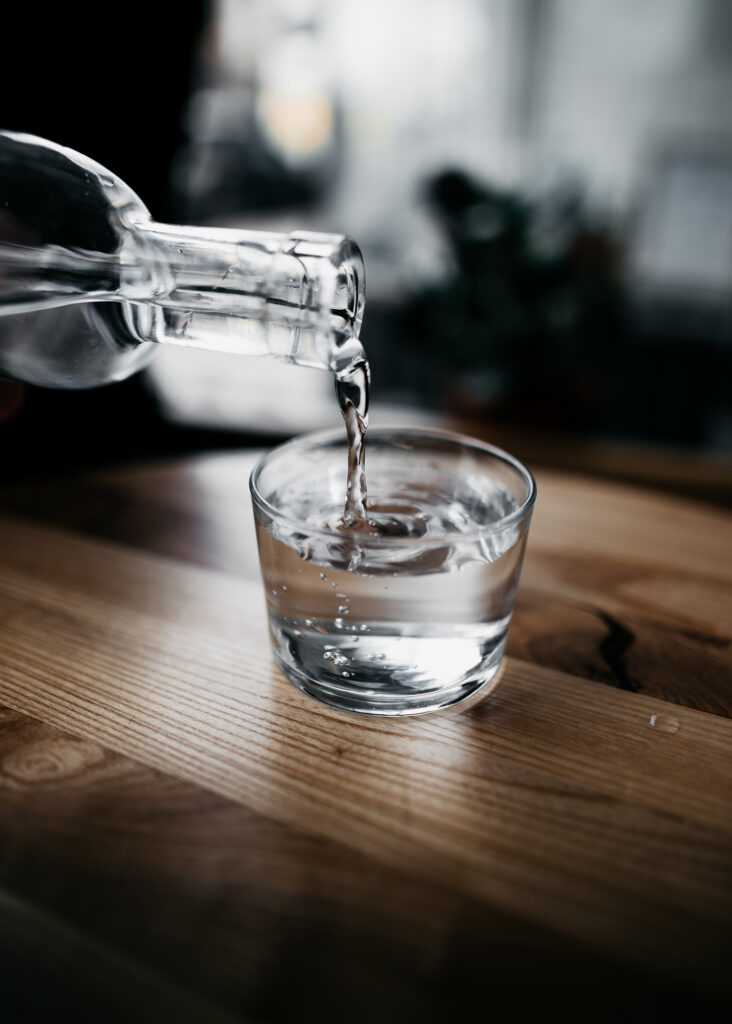 Water being poured into a glass. Top 6 things to do when you have been glutened.